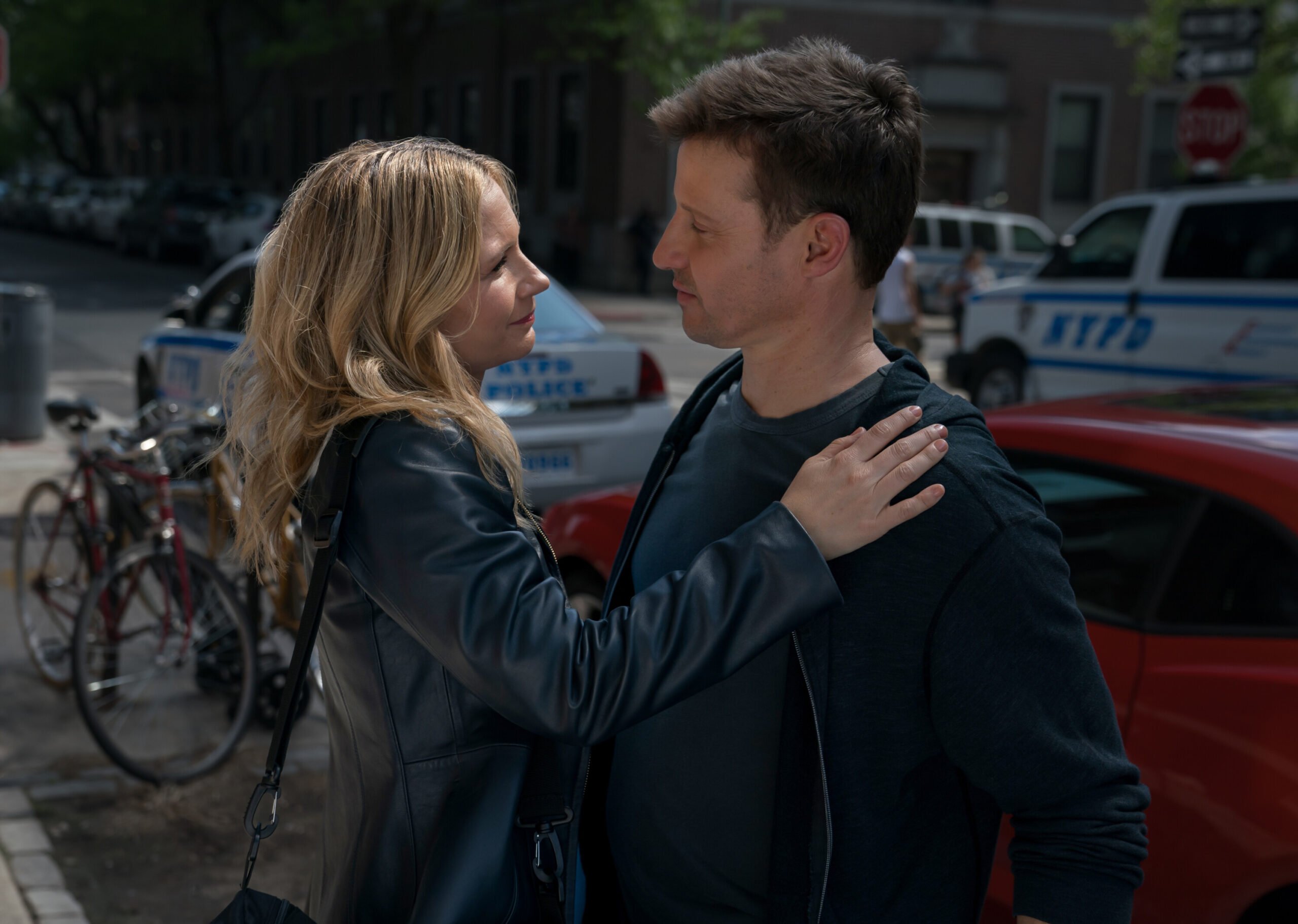 Jamie and Eddie hugging on a NYC street on Blue Bloods Season 14 Episode 15