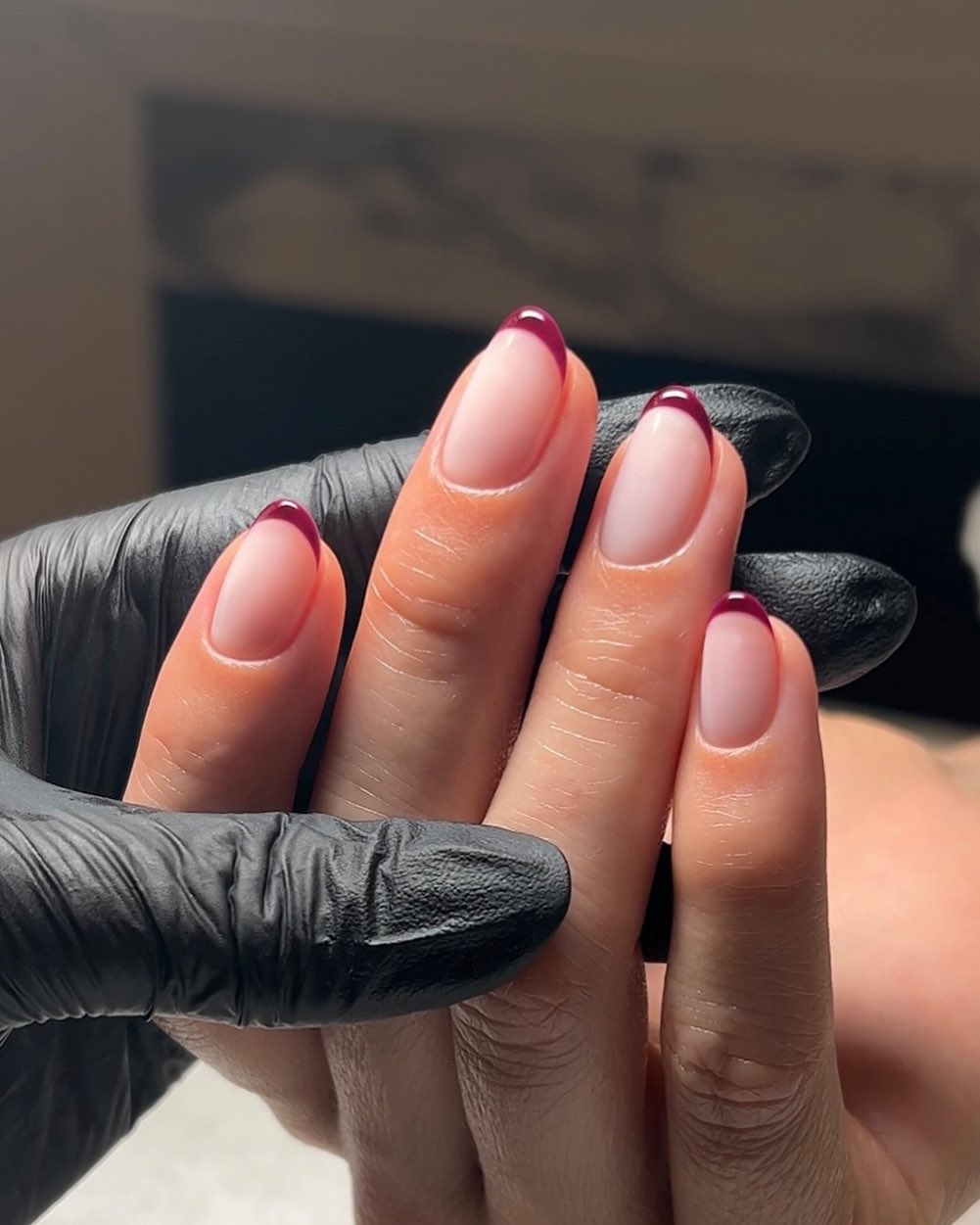 A French manicure with berry tips by Georgia Rae